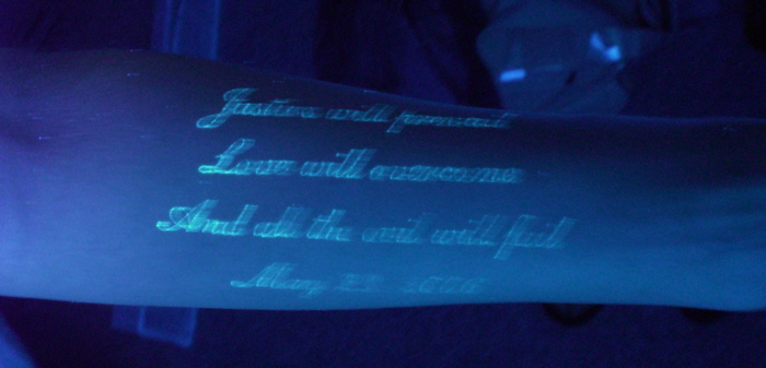 This glow-in-the-dark tattoo is on the left arm of my youngest daughter.